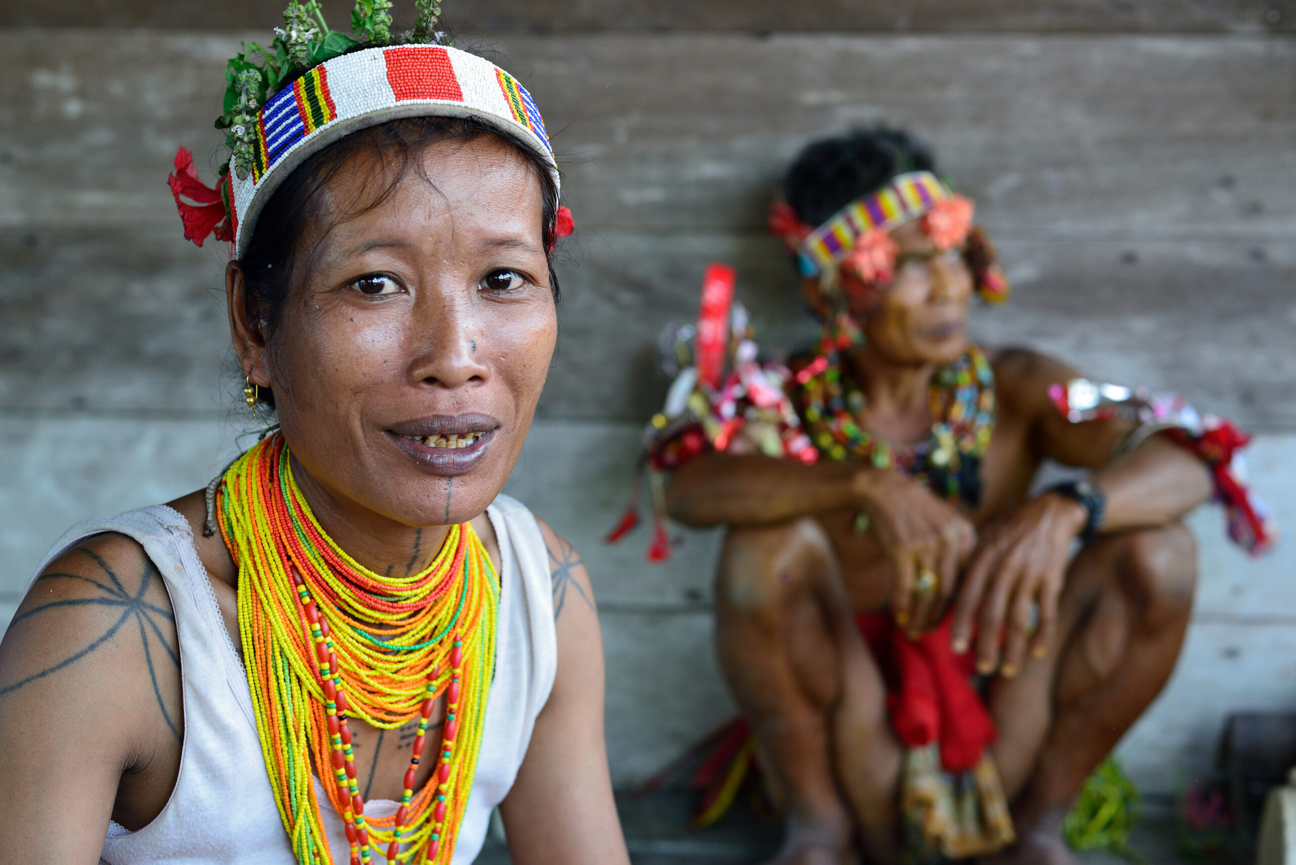 Portrait  tribal woman - shaman, with traditional tattoos, at his rainforest home Uma, during the traditional ceremony for the protection of the clan