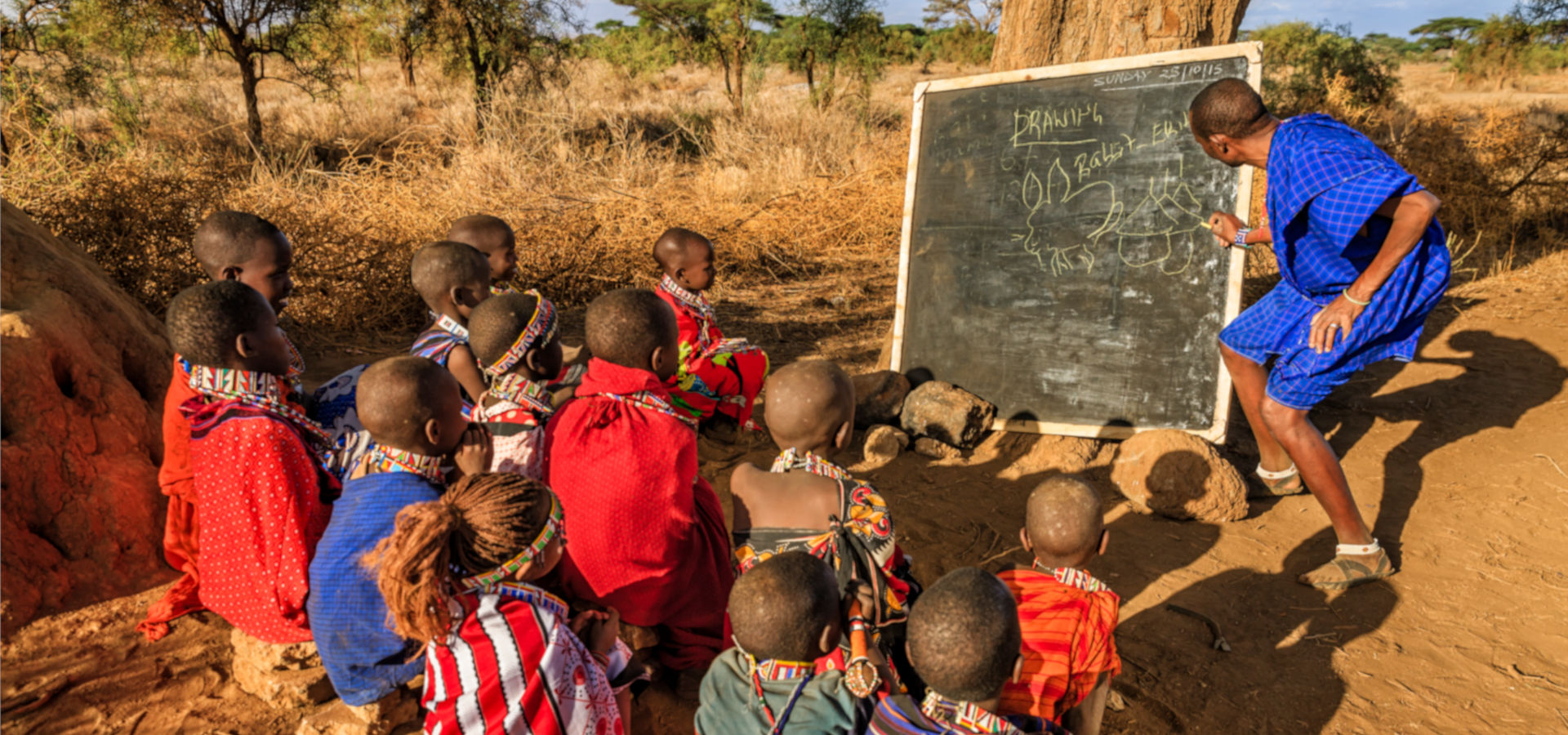 Group photo of indigenous Maasai children from Kenya in outdoor classes.