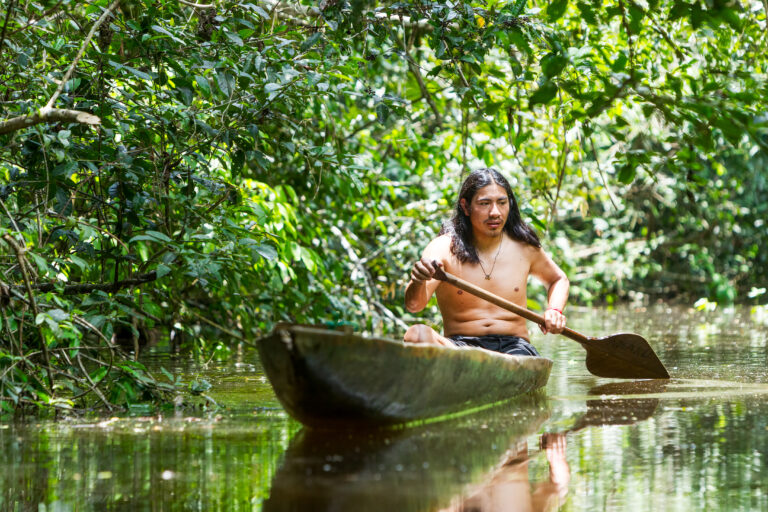 man in boat, Ecuador Amazon